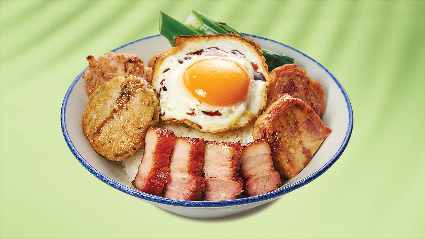 Pan Fried Fish Cake and Pork Patty with Salted Fish, Barbecued Pork, and Fried Egg over Steamed Rice